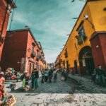 Image of mexican streets used in la neta meaning article, vibrant buildings with a road in the middle